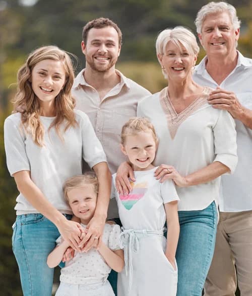 Three generations of a family smiling together