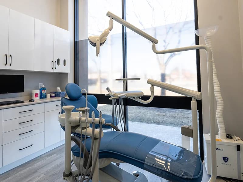 A treatment room with modern dental chair