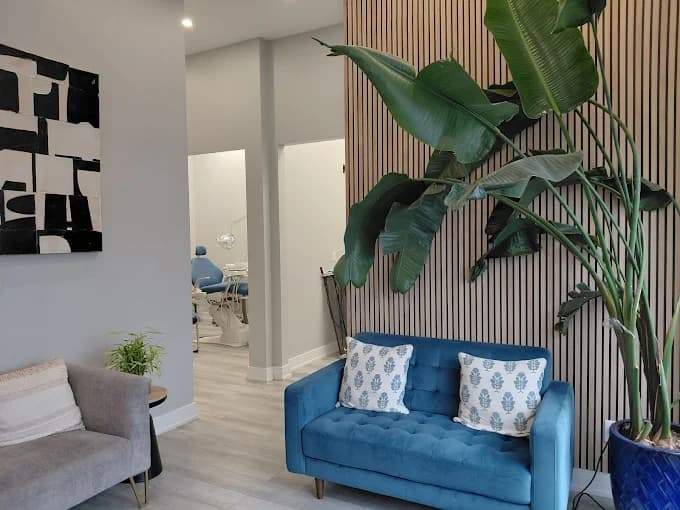 Lounge area with a view into a treatment room