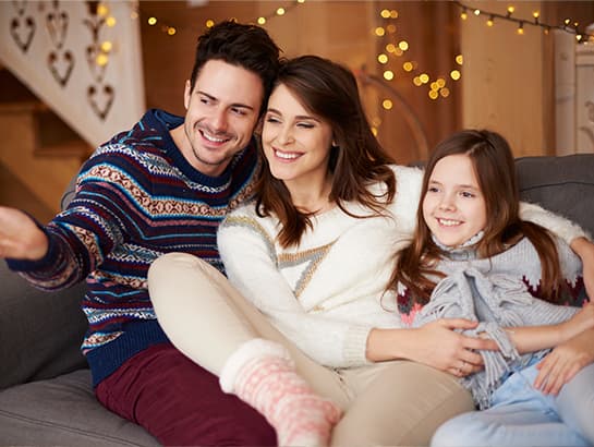 A family relaxing together at home, the kind of patients CDCP coverage supports